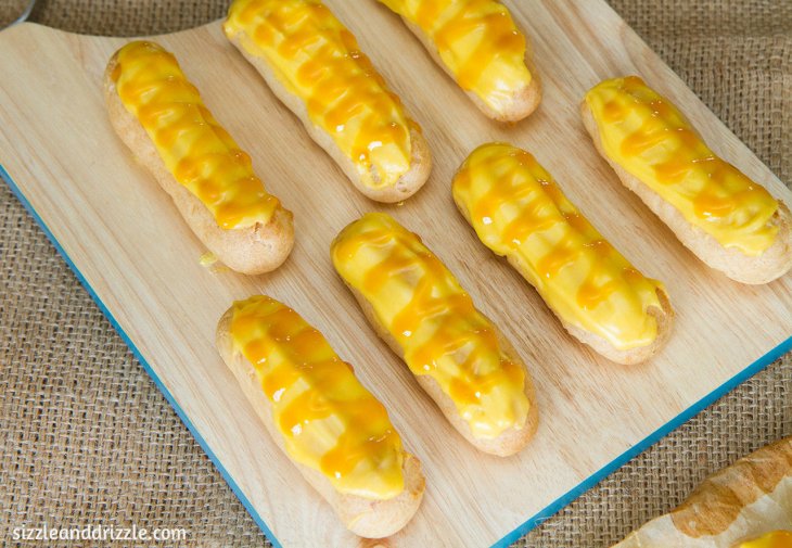 Mango eclairs on a board