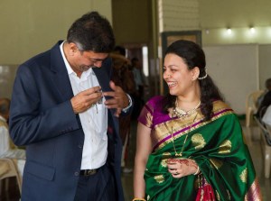 Baba putting away glasses